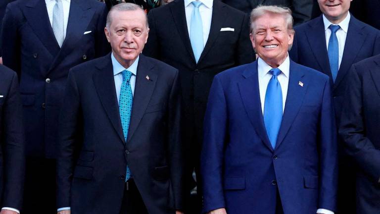 Turkey's President Tayyip Erdogan and U.S. President Donald Trump pose for a picture ahead of a dinner hosted by Dutch King Willem-Alexander and Dutch Queen Maxima, on the sidelines of a NATO Summit, at Huis ten Bosch Palace in The Hague, Netherlands June 24, 2025. - REUTERSPIX