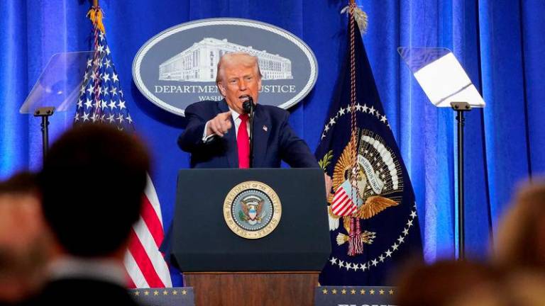 U.S. President Donald Trump speaks during his visit to the Department of Justice to address its workers, in Washington, D.C., U.S., March 14, 2025. - REUTERSPIX