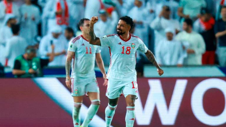 UAE’s forward #18 Caio Lucas celebrates after socring his team’s second goal during the FIFA World Cup 2026 Asian qualifier football match between United Arab Emirates and Oman. - Karim JAAFAR / AFP