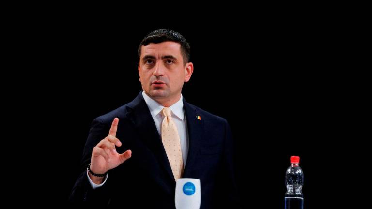 George Simion gestures while attending a presidential debate alongside Nicusor Dan (not pictured), in Bucharest, Romania, May 8, 2025. REUTERSpix