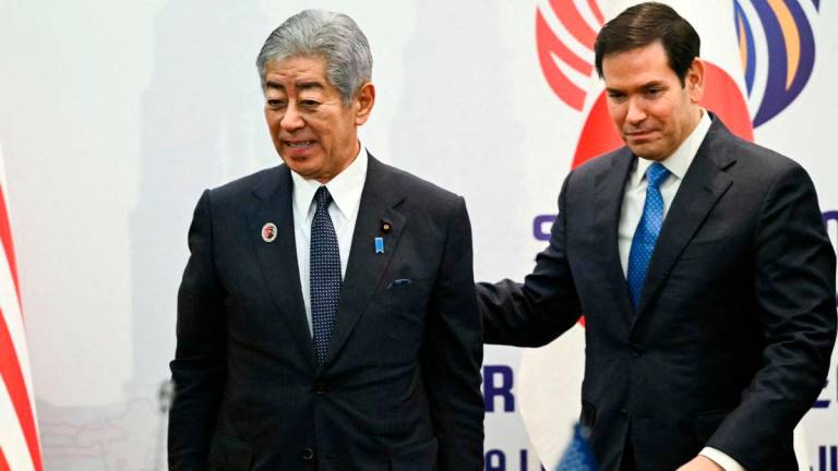 Japan’s Foreign Minister Takeshi Iwaya and US Secretary of State Marco Rubio arrive for a meeting on the sidelines of the ASEAN Foreign Ministers’ Meeting at the Kuala Lumpur Convention Centre in Kuala Lumpur, Malaysia July 11, 2025. MANDEL NGAN/Pool via REUTERS