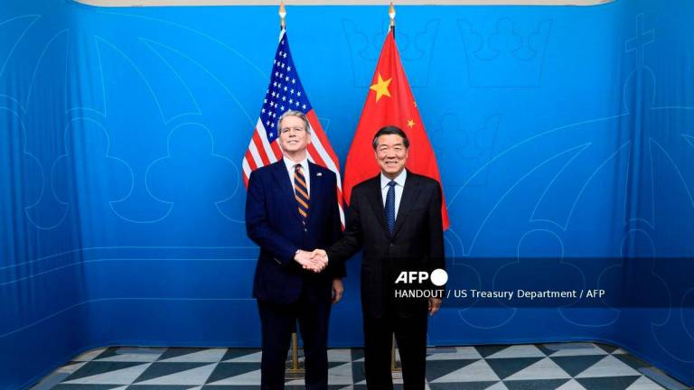 US Treasury Secretary Scott Bessent and Chinese Vice Premier He Lifeng standing for a photo during meetings in Stockholm, Sweden, on July 28, 2025. (Photo by HANDOUT / US Treasury Department / AFP)