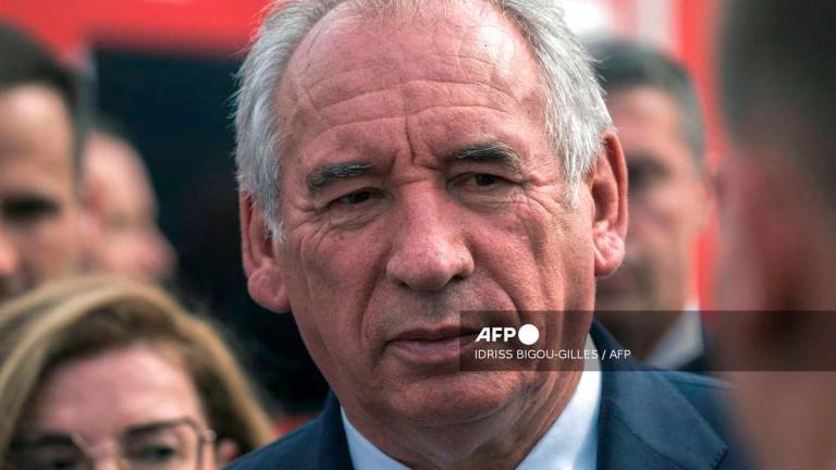 France's Prime Minister Francois Bayrou looks on during a visit to a field command post set up in Saint-Laurent-de-la-Cabrerisse, southern France, where a wildfire has scorched a vast area on August 6, 2025.- AFP