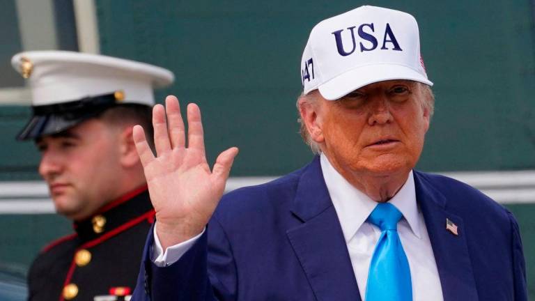U.S. President Donald Trump waves after disembarking Marine One at Joint Base Andrews, Maryland, U.S., June 6, 2025. REUTERS