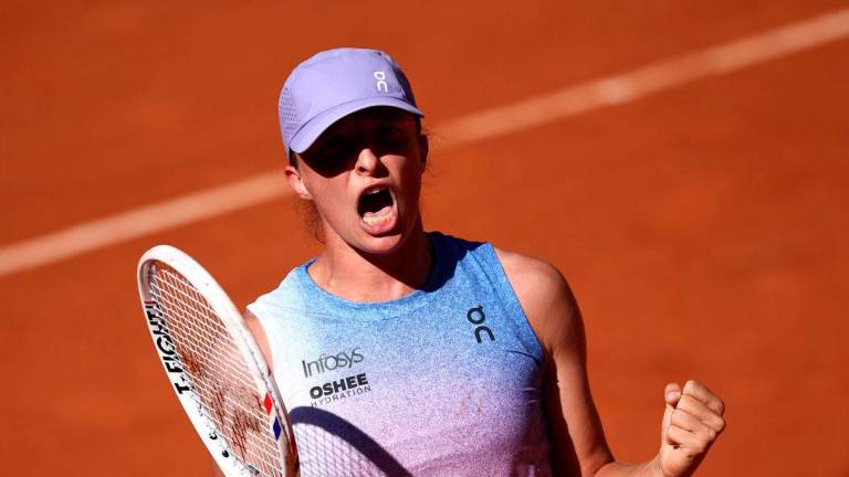 Poland’s Iga Swiatek celebrates after winning against Romania’s Jaqueline Cristian at the end of their women’s singles match on day 6 of the French Open tennis tournament on Court Suzanne-Lenglen at the Roland-Garros Complex in Paris on May 30, 2025.. AFPpix