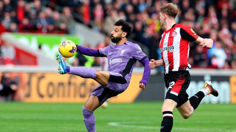 Liverpool’s Egyptian striker #11 Mohamed Salah controls the ball during the English Premier League football match between Brentford and Liverpool at the Gtech Community Stadium in London on February 17, 2024/AFPPix