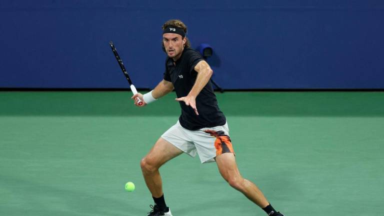 Greece’s Stefanos Tsitsipas hits a forehand return to Germany’s Daniel Altmaier during their men's singles second round tennis match on day five of the US Open tennis tournament at the USTA Billie Jean King National Tennis Center in New York City, on August 28, 2025. - AFPPIX
