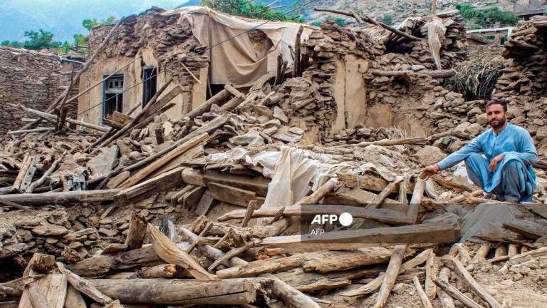 An Afghan man sits amid the remains of a damaged house, in the aftermath of an earthquake at the Dara-i-Nur district of Nangarhar province on September 3, 2025. - AFP