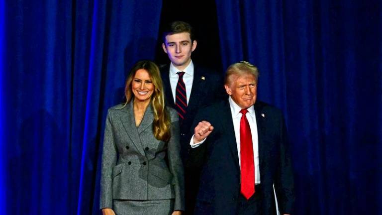 Donald Trump with his wife Melania Trump and his son Barron Trump - AFPpix