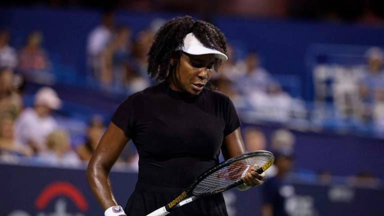 Venus Williams of the United States looks at her racket during a women’s singles match against Magdalena Frech of Poland on day 4 of the Mubadala Citi DC Open 2025 at William H.G. FitzGerald Tennis Center on July 24, 2025 in Washington, DC. Scott Taetsch/Getty Images/AFP - Photo by Scott Taetsch / GETTY IMAGES NORTH AMERICA / AFP