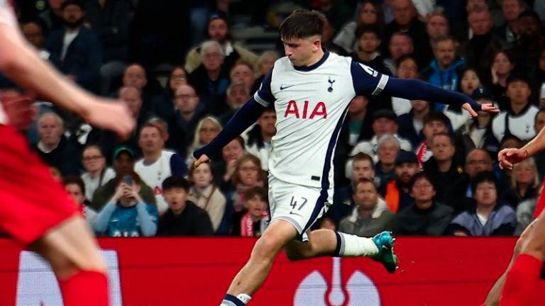 Tottenham Hotspur's English midfielder #47 Mikey Moore crosses the ball during the UEFA Europa League, League stage day 3 football match between Tottenham Hotspur and AZ Alkmaar at the Tottenham Hotspur Stadium in London, on October 24, 2024. - AFPPIX