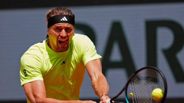 Germany’s Alexander Zverev plays a backhand return to Netherlands’ Tallon Griekspoor during their men’s singles match on day 9 of the French Open tennis tournament on Court Suzanne-Lenglen at the Roland-Garros Complex in Paris on June 2, 2025. (Photo by Dimitar DILKOFF / AFP)