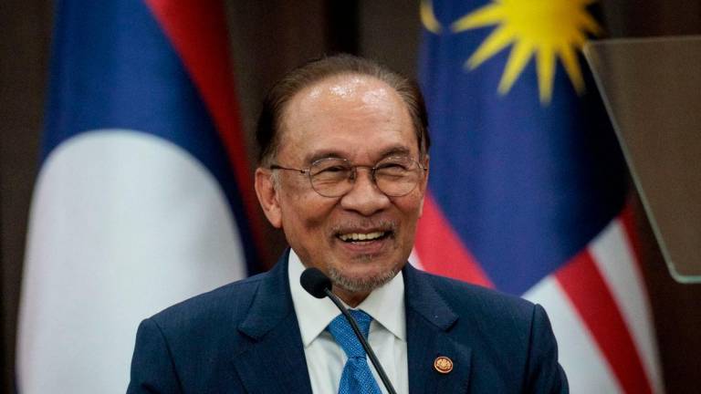 Prime Minister Anwar Ibrahim delivers a speech at the Association of Southeast Asian Nations (ASEAN) Secretariat in Jakarta on July 29, 2025. (Photo by YASUYOSHI CHIBA / AFP)