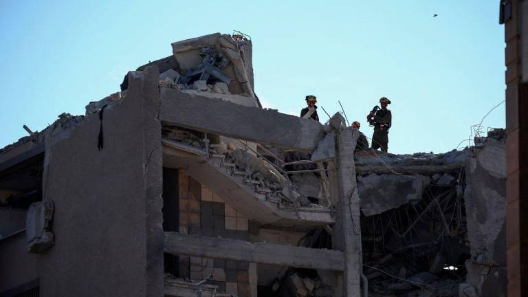 Emergency personnel work at an impact site following Iran's missile strike on Israel, amid the Iran-Israel conflict, in Haifa, Israel, June 20, 2025. - REUTERSPIX
