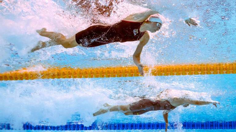 An underwater view shows USA’s Gretchen Walsh (top) as she competes in a heat of the women's 50m freestyle swimming event during the 2025 World Aquatics Championships in Singapore on August 2, 2025. - AFPPIX