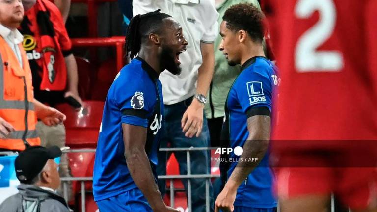 Bournemouth's Ghanaian striker #24 Antoine Semenyo (L) celebrates with Bournemouth's English midfielder #16 Marcus Tavernier (R) after scoring their second goal during the English Premier League football match between Liverpool and Bournemouth at Anfield in Liverpool, north west England on August 15, 2025. - AFP
