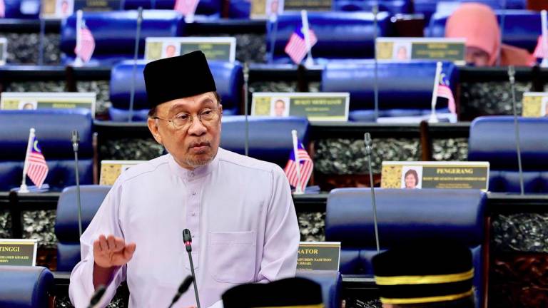 Prime Minister Datuk Seri Anwar Ibrahim answers questions during the Second Meeting of the Fourth Session of the 15th Parliament in the Dewan Rakyat, Parliament Building, today. - BERNAMA