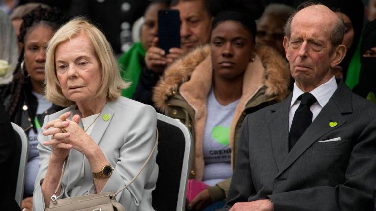 (FILES) The Duke and Duchess of Kent attend a service for the national minute silence and mosaic unveiling at the base of Grenfell Tower as part of commemorations on the anniversary of the Grenfell fire in west London on June 14, 2018. (Photo by Stefan Rousseau / POOL / AFP)