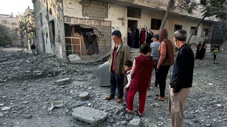 Palestinians inspect the damage after an overnight Israeli airstrike in Beit Lahia the northern Gaza Strip on October 27, 2024 amid the ongoing war in the Palestinian territory between Israel and Hamas. - AFPPIX