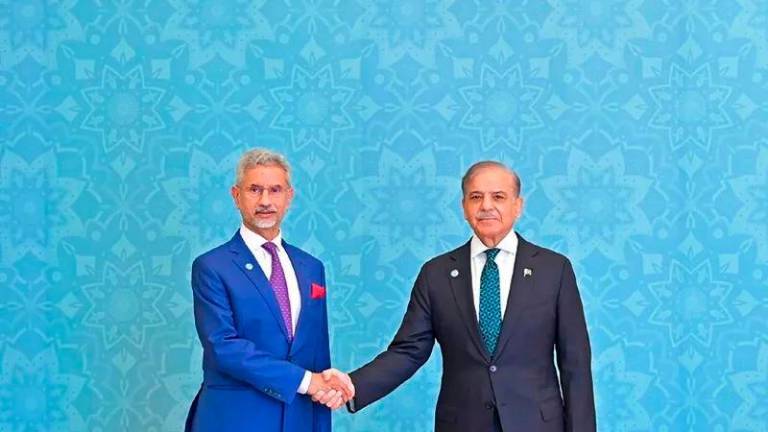 Indian Foreign Minister Subrahmanyam Jaishankar shakes hands with Pakistan’s Prime Minister Shehbaz Sharif during the first visit to Islamabad - AFPpix