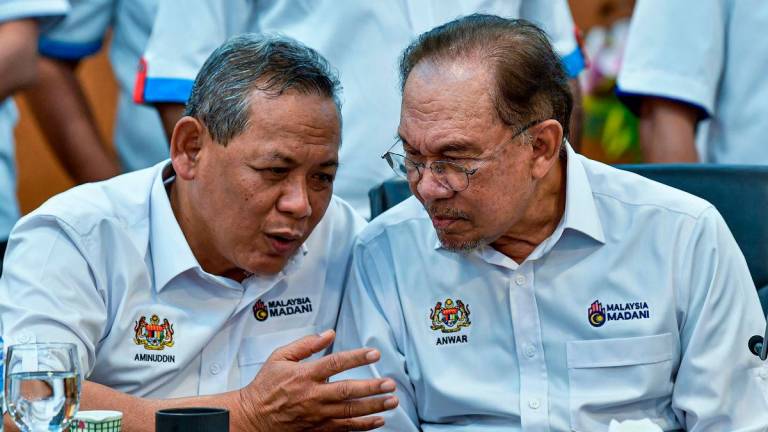 Negeri Sembilan Menteri Besar Datuk Seri Aminuddin Harun and Prime Minister Datuk Seri Anwar Ibrahim - Photo by BERNAMA