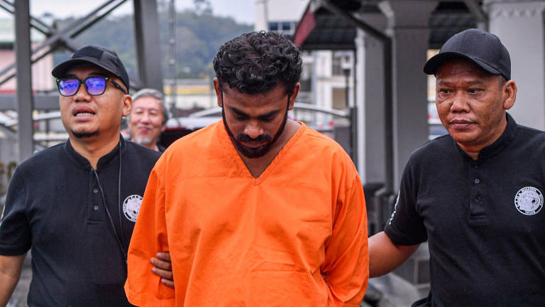 M. Arunkumar, 36, was charged in the Magistrate’s Court here today with the murder of his six-year-old son by the roadside at Kilometre 25 of Jalan Rompin, Bahau, last month. – BERNAMA