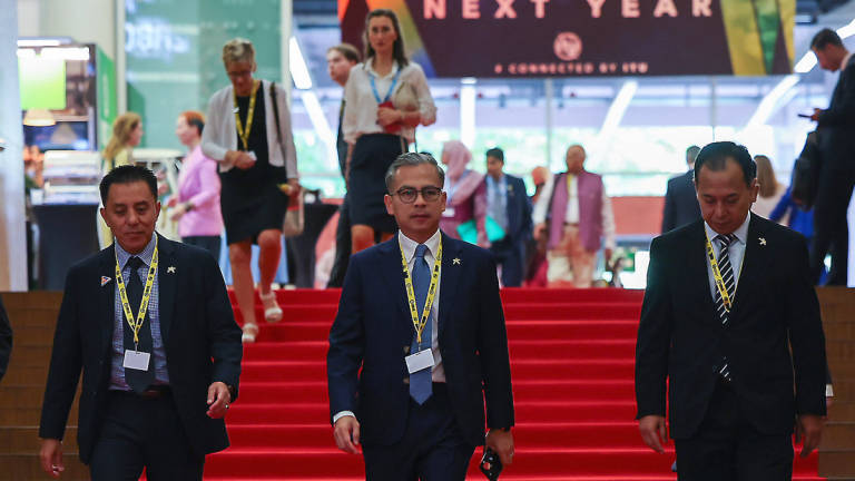 Minister of Communications Datuk Fahmi Fadzil (center) attends the opening ceremony in conjunction with the High-Level Event of the World Summit on the Information Society+20 (WSIS+20), here, today. - BERNAMA