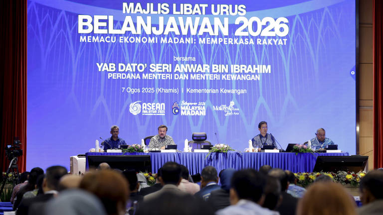 Second Finance Minister, Datuk Seri Amir Hamzah Azizan (second from left), delivers the keynote address at the 2026 Budget Engagement Session at the Ministry of Finance today. Also present were Treasury Secretary-General Datuk Johan Mahmood Merican (second from right) and Bank Negara Governor Datuk Shaik Abdul Rasheed Abdul Ghaffour. – BERNAMA