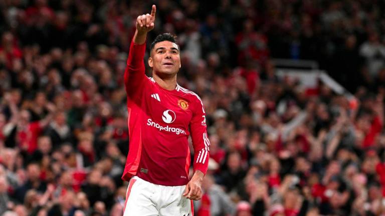 Manchester United's Brazilian midfielder #18 Casemiro celebrates after scoring Manchester United's second goal during the UEFA Europa League semi final second leg football match between Manchester United and Athletic Club Bilbao at Old Trafford stadium in Manchester, north west England, on May 8, 2025. - AFPPIX