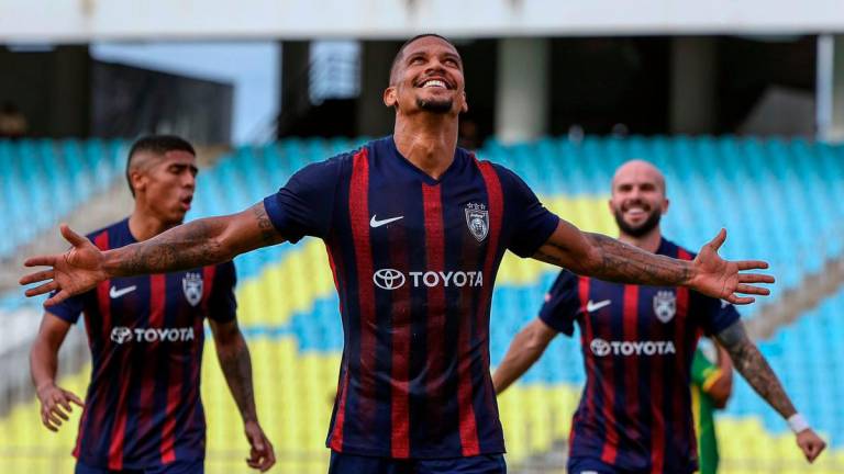 Johor Darul Ta’zim (JDT) player Jairo De Maceda Da Silva (centre) celebrates scoring a goal during the Super League match against Imigresen FC at the State Stadium in Batu Kawan today. - BERNAMA