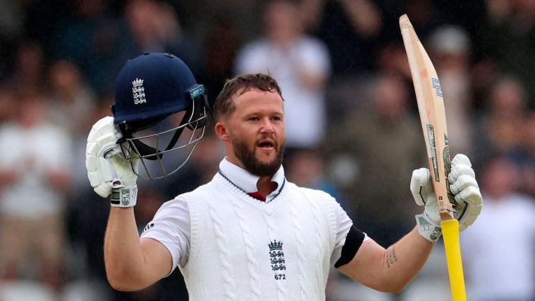 England’s Ben Duckett celebrates his century on day five of the first cricket test match between England and India at Headingley cricket ground in Leeds, northern England on June 24, 2025. (Photo by Darren Staples / AFP)