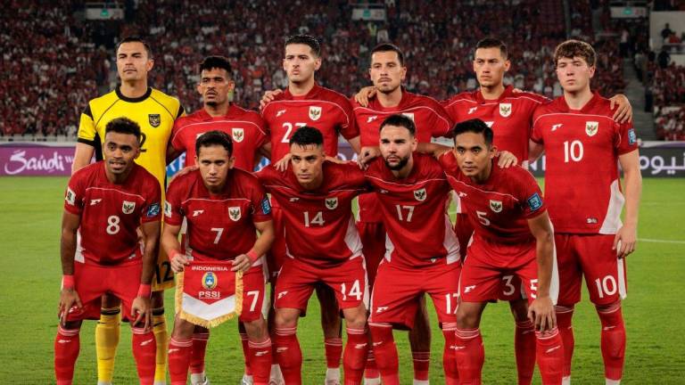 Indonesia’s players pose for a team photo ahead of the FIFA World Cup 2026 Asian qualifier football match. - Yasuyoshi CHIBA / AFP