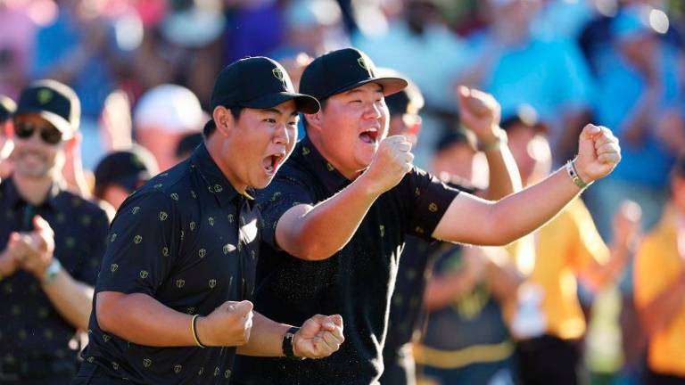 Tom Kim (left) and Sungjae Im at the 2022 Presidents Cup. – Getty Images