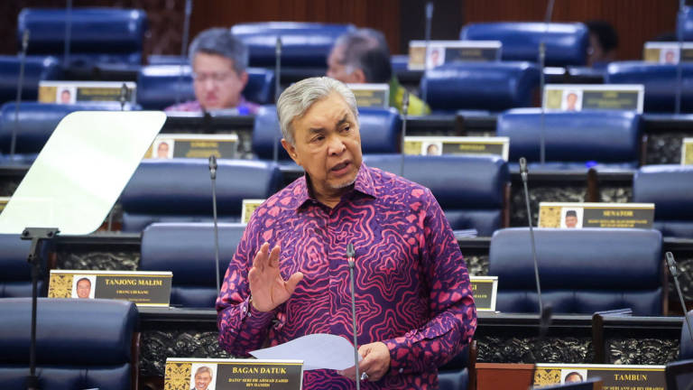 Deputy Prime Minister and Minister of Rural and Regional Development, Datuk Seri Dr Ahmad Zahid Hamidi, speaks during the Second Meeting of the Fourth Session of the 15th Parliament at the Parliament Building today. – BERNAMA