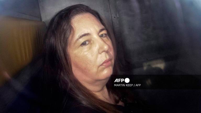 This picture taken on May 12, 2025 shows Erin Patterson arriving in the back of a prison transport vehicle at Latrobe Valley Magistrate's Court in Morwell, Australia. - AFP