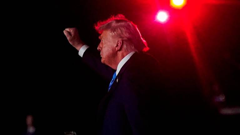 U.S. President Donald Trump makes a fist as he arrives at John F. Kennedy International Airport, ahead of the 80th United Nations General Assembly, in New York, U.S., September 22, 2025. - REUTERSPIX