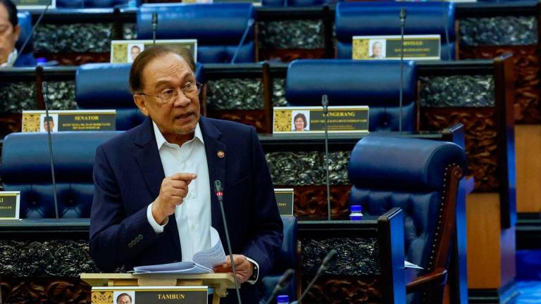 Anwar stressing a point in the Dewan Rakyat yesterday. – BERNAMAPIC