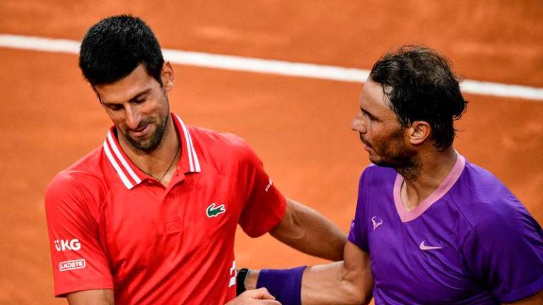 Spain’s Rafael Nadal greets Serbia’s Novak Djokovic after defeating him in the final of the Men’s Italian Tennis Open at Foro Italico on May 16, 2021 - AFPpix