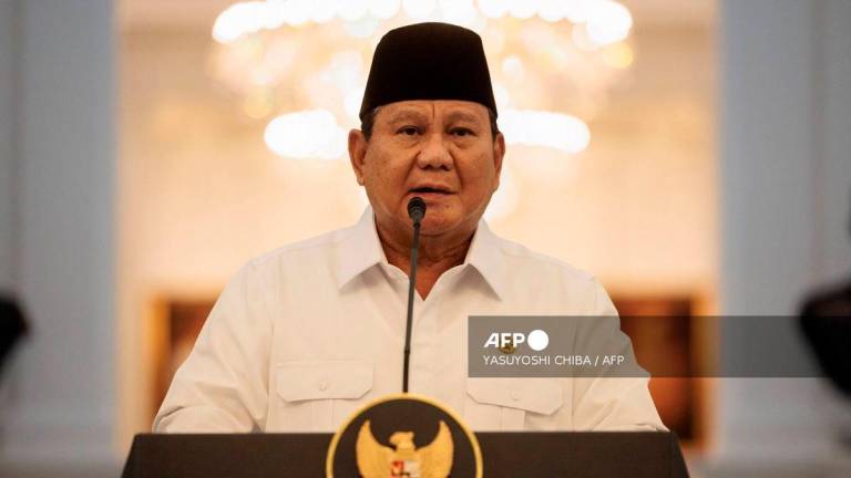 Indonesia’s President Prabowo Subianto speaks about a recent wave of nationwide protests during a press conference alongside political party leaders at the Presidential Palace in Jakarta on August 31, 2025. (Photo by YASUYOSHI CHIBA / AFP)