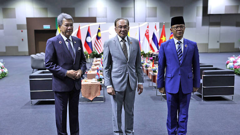 Prime Minister Datuk Seri Anwar Ibrahim receives a courtesy call from Indonesia’s Foreign Minister Sugiono on the sidelines of the 58th ASEAN Foreign Ministers’ Meeting and Related Meetings at the Kuala Lumpur Convention Centre today. Also present is Malaysian Foreign Minister Datuk Seri Mohamad Hasan (left). - BERNAMA