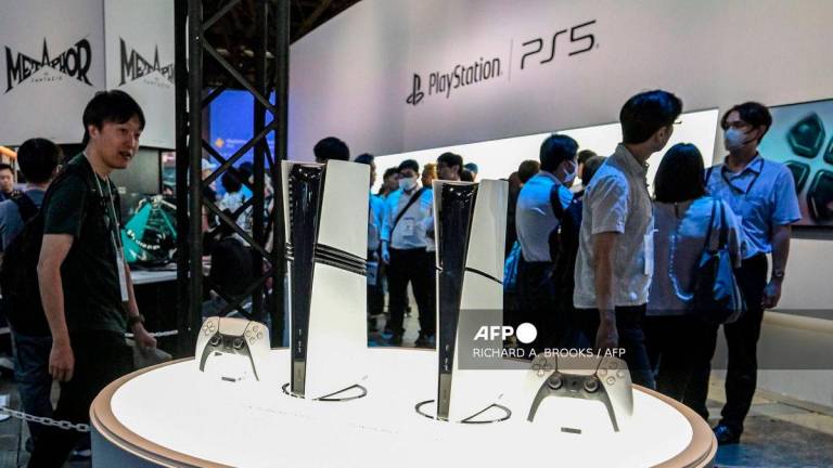 This photo taken on September 26, 2024 shows a display with the Sony PlayStation 5 during the preview day for the annual Tokyo Game Show at Makuhari Messe in the city of Chiba, Chiba Prefecture. - AFP