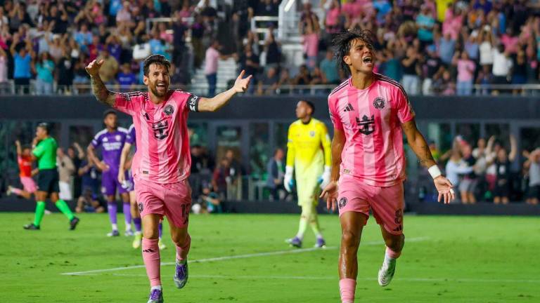 Inter Miami's Argentine forward #10 Lionel Messi and Inter Miami's Venezuelan midfielder #08 Telasco Segovia celebrate a third goal during the Leagues Cup semi-final football match between Inter Miami CF and Orlando City SC at Chase Stadium in Fort Lauderdale, Florida, on August 27, 2025. - AFPPIX