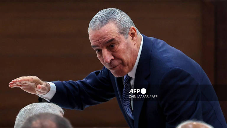Hussein al-Sheikh, deputy to Palestinian Authority president Mahmud Abbas, gestures as he arrives for the 32nd Palestinian Liberation Organization (PLO) Central Council session in Ramallah on April 23, 2025. - AFP