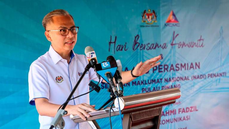 Communications Minister Datuk Fahmi Fadzil delivered a speech at the Community Day and the Launch of the National Information Dissemination Centre (NADI) Penanti today. – BERNAMA
