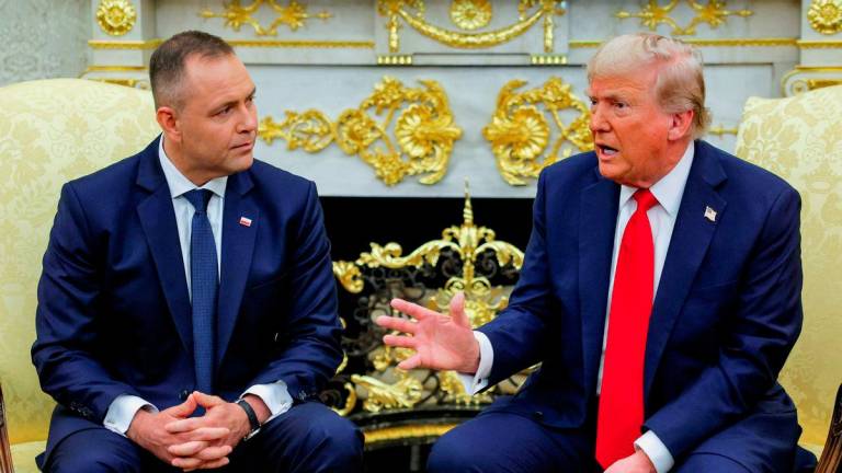 U.S. President Donald Trump gestures while sitting next to the President of Poland Karol Nawrocki during a meeting in the Oval Office at the White House in Washington, D.C., U.S., September 3, 2025. - REUTERSPIX