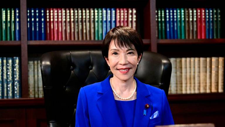 Sanae Takaichi, the newly elected leader of Japan’s ruling Liberal Democratic Party (LDP), poses in the party leader’s office after the LDP leadership election in Tokyo, Japan, October 4, 2025. Yuichi Yamazaki/Pool via REUTERS
