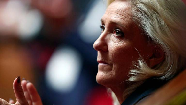 President of Rassemblement National parliamentary group Marine Le Pen applauds during a debate at the National Assembly before a vote on the ‘Duplomb law’ on agriculture which aims to reintroduce a pesticide for certain crops, in Paris on July 8, 2025. (Photo by Guillaume BAPTISTE / AFP)