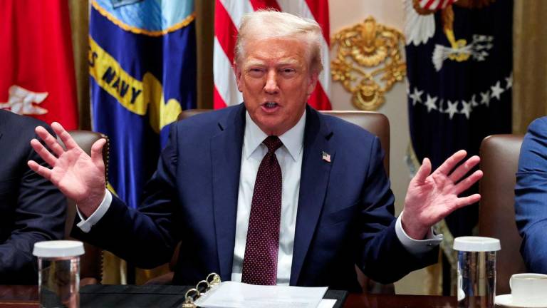 U.S. President Donald Trump gestures during a cabinet meeting at the White House in Washington, D.C., U.S., August 26, 2025. - REUTERSPIX