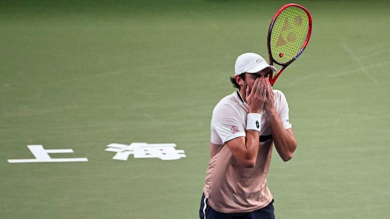 Monaco's Valentin Vacherot celebrates his victory against France’s Arthur Rinderknech during the men’s singles final at the Shanghai Masters tennis tournament in Shanghai on October 12, 2025. - AFPPIX
