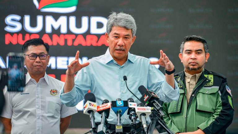Foreign Minister Datuk Seri Mohamad Hassan (centre) during a press conference on the latest developments concerning the 23 Malaysian participants of the Global Sumud Flotilla (GSF) currently detained by Israel, at the Sumud Nusantara Command Centre (SNCC) today. Also present were Deputy Foreign Minister Datuk Mohamad Alamin (left) and SNCC Director-General Datuk Dr Sani Araby Abdul Alim Araby (right). – BERNAMA